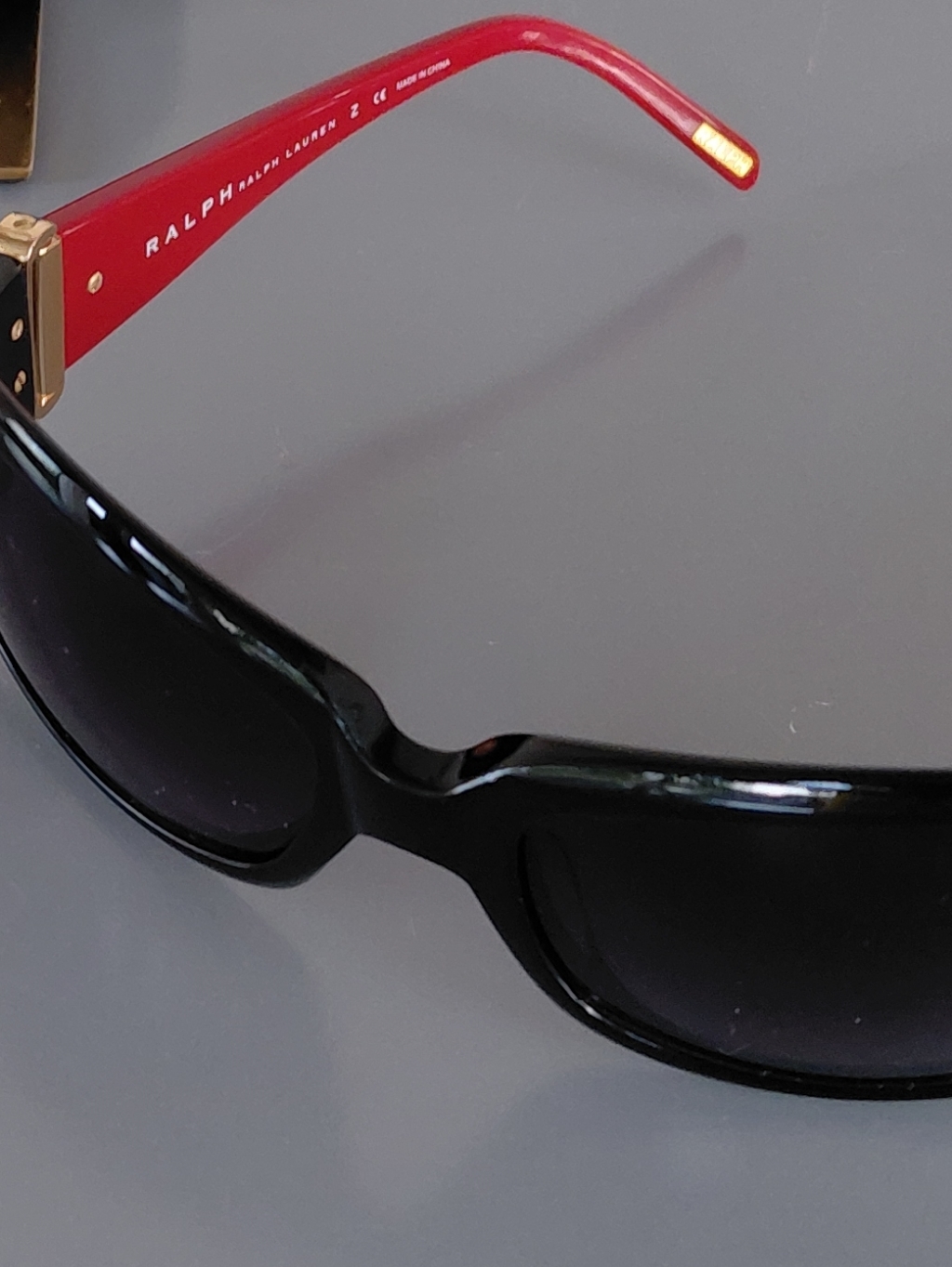 Ralph Lauren Black Frame Sunglasses With Red Temples